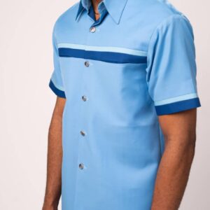 Light blue short-sleeved shirt with dark blue chest stripe and trim, paired with dark blue trousers and black sandals.